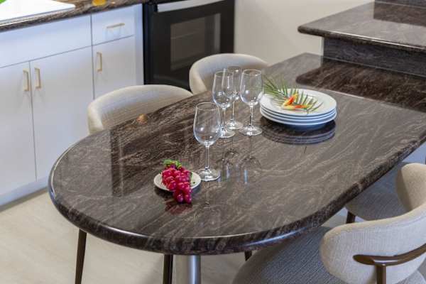 Enjoy intimate dining at your sleek, polished granite table in the kitchen area