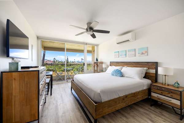 Relax in your light-filled studio with a comfortable bed, 32" Roku Smart TV, air conditioning, and seamless sliding-door access to the balcony.