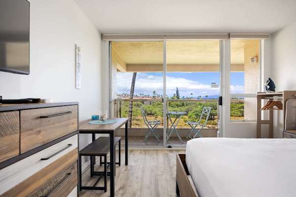 Dine indoors or step outside through sliding glass doors to enjoy outdoor seating on the private balcony with scenic views.