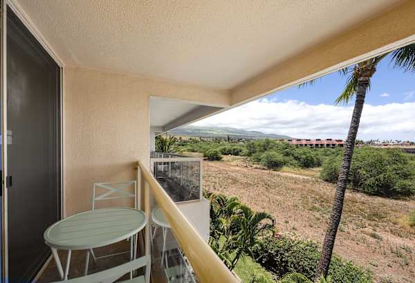 Soak in island breezes and scenic mountain views from your private balcony, complete with comfortable outdoor seating.