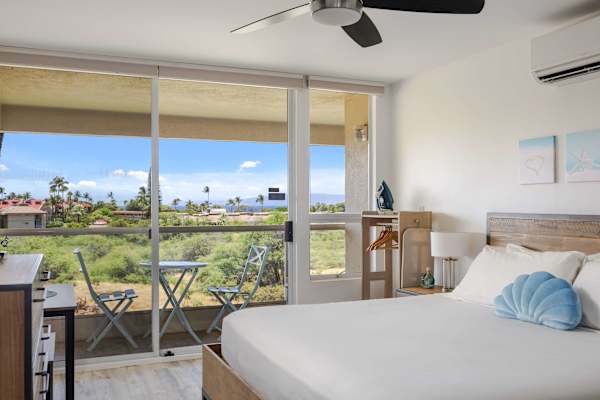 Enjoy your stay in your bright, beach-inspired studio with an open-air balcony and a tropical view.
