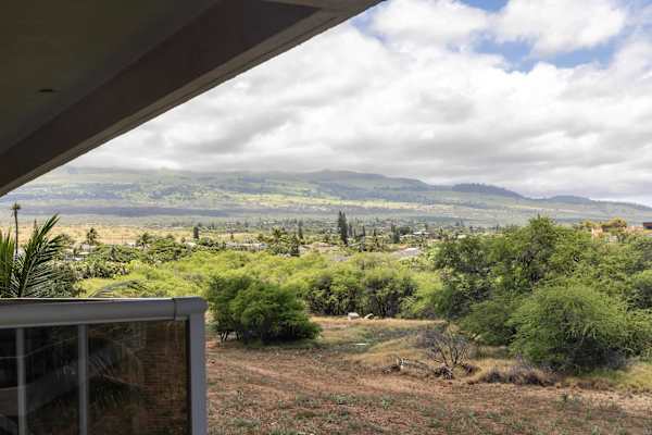 Take in sweeping views of rolling green hills and majestic mountain ranges under a sunny island sky.
