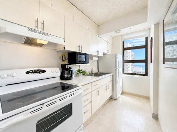 Prepare your favorite home-cooked meals in your clean, bright kitchen, complete with full appliances, ample storage, and a scenic ocean-view window