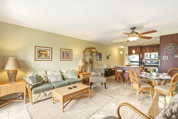 Experience island-style comfort in your open-layout condo connecting a cozy living room, charming dining space, and well-appointed kitchen.
