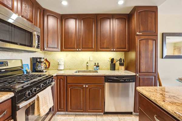 Enjoy all the comforts of home in your chef-friendly kitchen, complete with warm cabinetry, stainless steel appliances, and ample counter space.