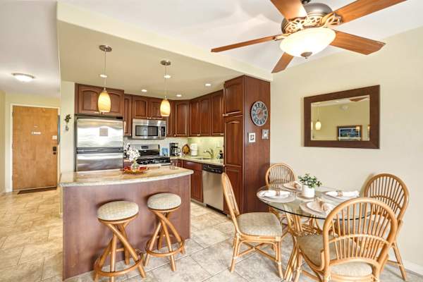 Gather for meals or casual snacks in your welcoming dining area, right alongside a fully appointed kitchen with a cozy breakfast bar.