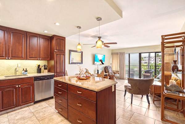 Experience convenience in your bright, open-concept condo, connecting a fully equipped kitchen island to the inviting living space and private balcony.