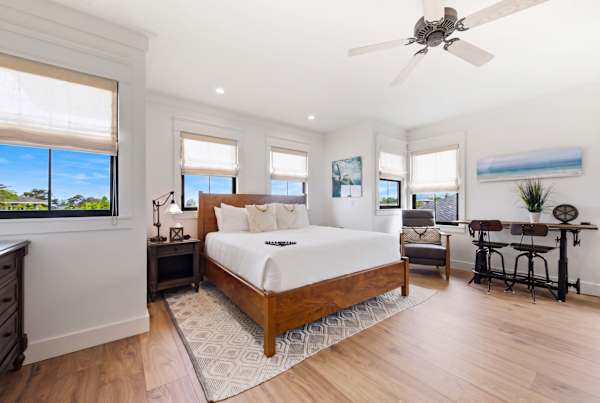 Well-lit room with a king sized bed