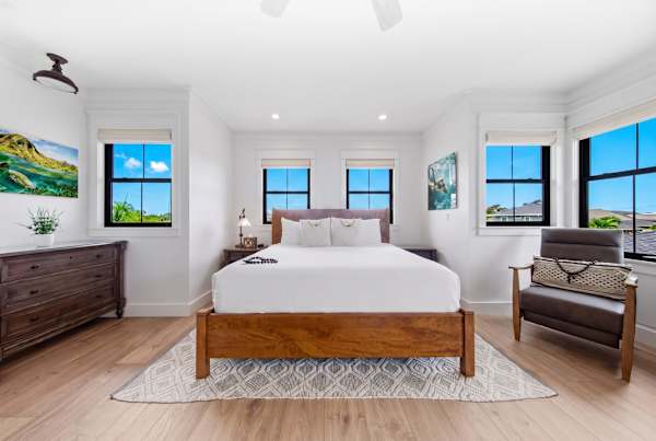 Well-lit room with a king sized bed