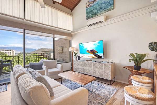 Unwind in your bright, airy living space featuring soaring vaulted ceilings, a comfortable sleeper sofa, and a 58" cable TV for the ultimate relaxation.