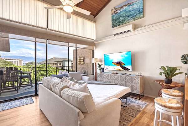 Relax in comfort on your pull-out sleeper sofa set up right in front of the 58" TV, offering high ceilings, air conditioning, and seamless access to the scenic lanai.