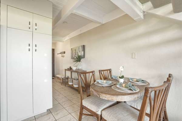 Enjoy intimate meals at this charming round dining table set for four, conveniently located right off the kitchen and entryway.