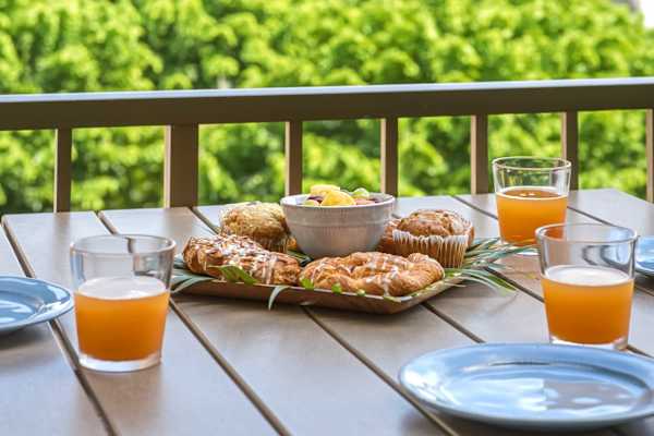 Savor morning coffee or breakfast out on the private balcony while taking in lush, tropical green views.