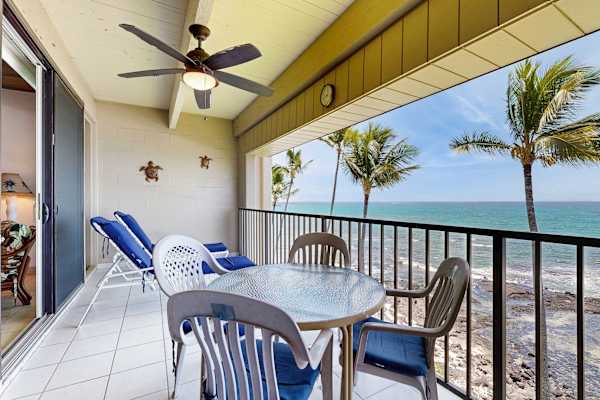 Covered Oceanfront Balcony with Ceiling Fan, Seating, Lounge Chairs, and Beach Views
