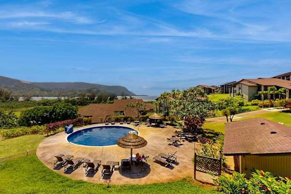 Sweeping resort views showcase lush greenery mountains and sparkling waters