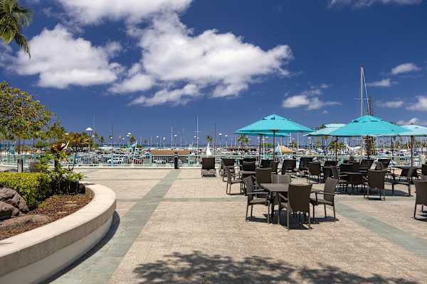 Enjoy outdoor dining in Ilikai Hotel's deck area