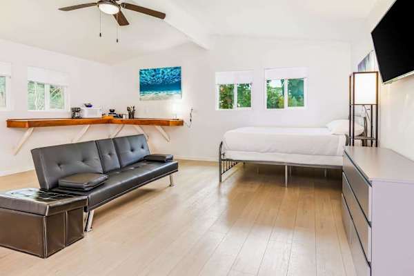 Studio with queen bed and flat screen tv.