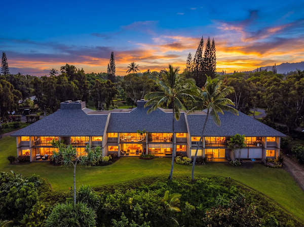 Well-presented property grounds feature colorful foliage and mountain outlooks nearby