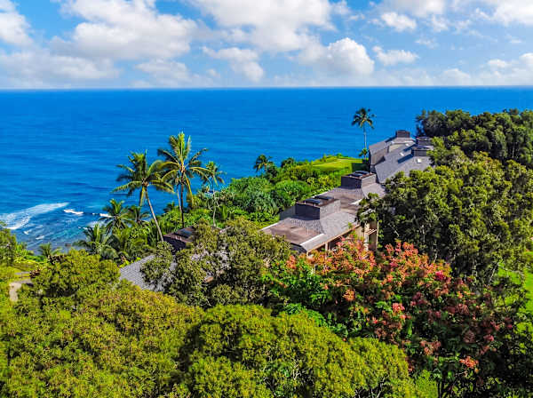Island surroundings reveal lush gardens, rolling hills, and peaceful greenery