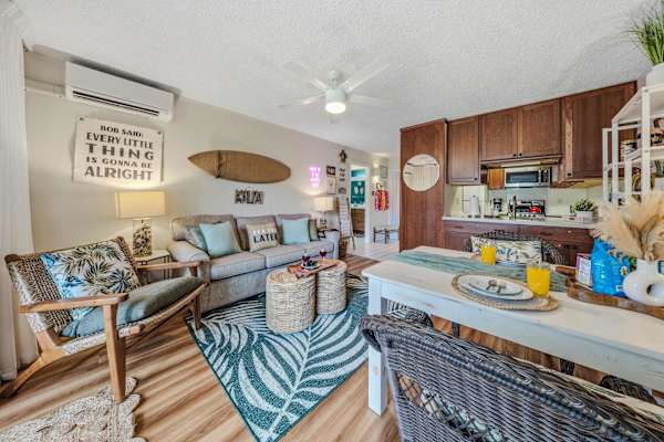 Open-Concept Living Suite with Sofa, Dining Table & Kitchen