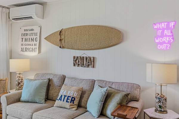 Living Room Sofa Wall with Coastal Décor & AC Unit