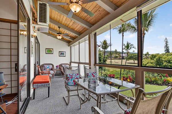 Covered balcony with outdoor seating and scenic views