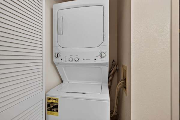 In-unit stacked washer and dryer in laundry closet