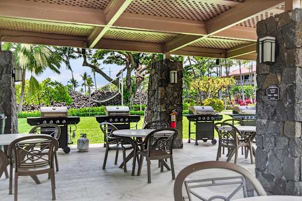 Community BBQ grilling station and covered patio dining area