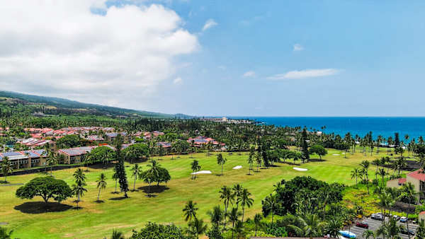 Elevated view of lush golf course green and surrounding resort grounds