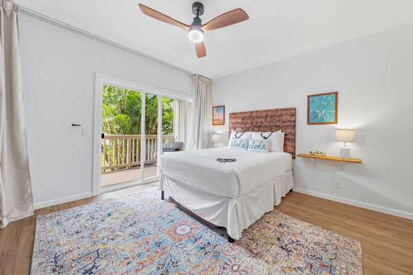 Queen Bedroom with Lanai Access and Coastal Decor