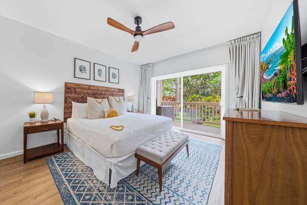 Master King Bedroom with Wood Headboard and Lanai Views