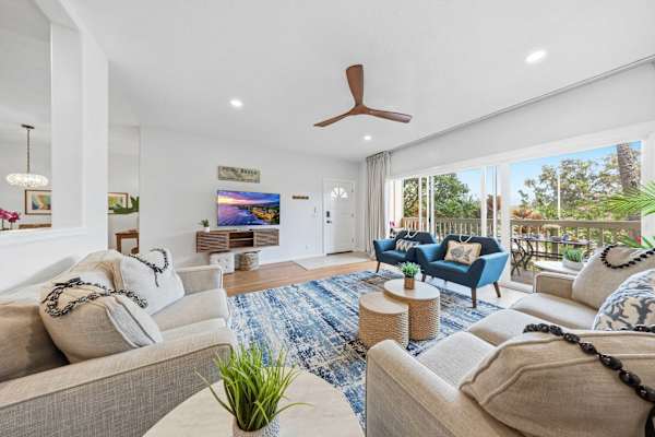 Spacious Living Room with Ceiling Fan and Garden Views