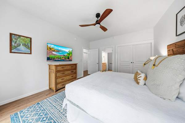 King Bedroom with TV, Dresser, and Ceiling Fan