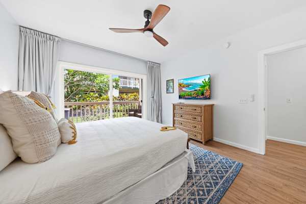 King Bedroom with Ceiling Fan and Balcony Access