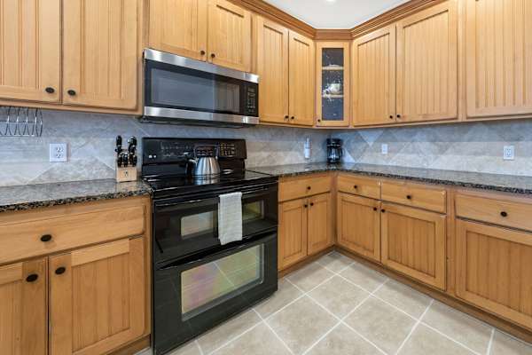 Well-Appointed Kitchen with Wood Cabinets and Double Oven