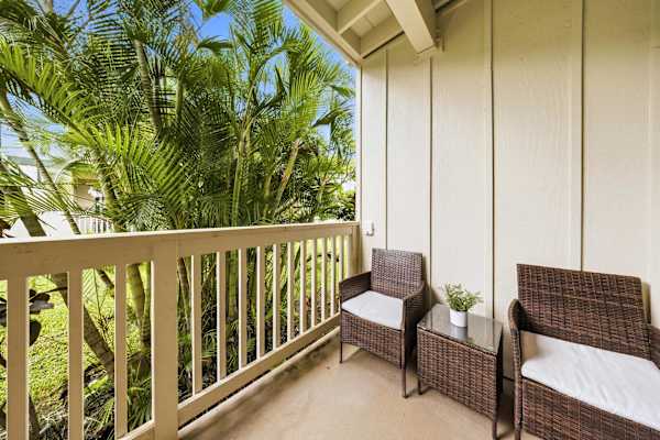 Lanai with Wicker Chairs and Tropical Palm Views