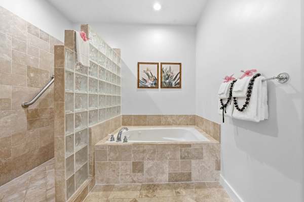 Soaking Tub with Glass Block Wall and Grab Bars