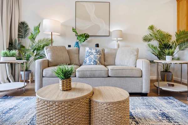 Cozy Living Room with Rattan Coffee Tables and Greenery