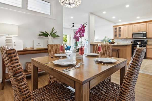 Wicker Dining Set with Table Setting Near the Kitchen