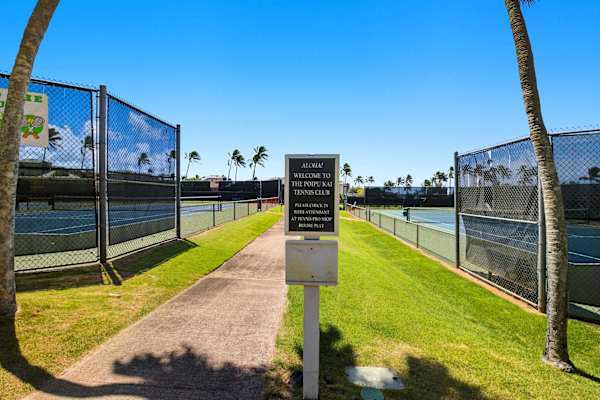 Palm-Lined Path to the Tennis Courts with Welcome Sign