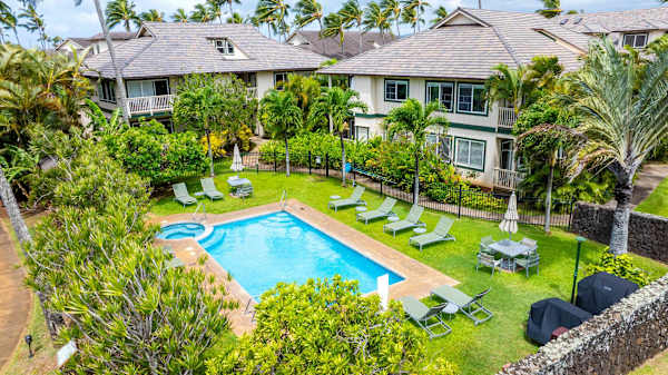 Community Pool Surrounded by Buildings and Tropical Palms