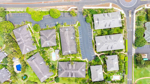 Aerial View of the Community with Rooftops and Pool