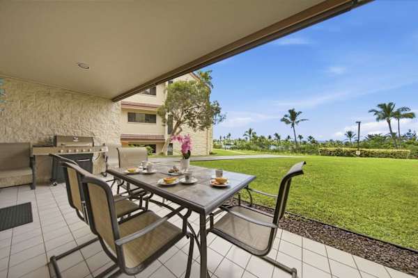 The lanai provides a view of the ocean.
