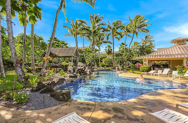 Relax in the shade of the palm trees at Nihilani
