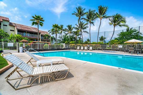 Spacious pool area with tropical surroundings