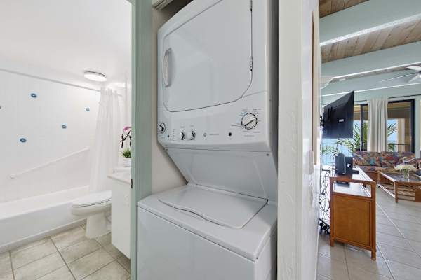 Laundry closet near full bathroom