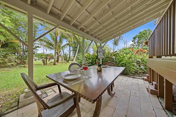 Covered lanai with outdoor dining area.