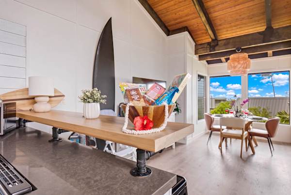 Kitchen bar with access to dining area and lanai 