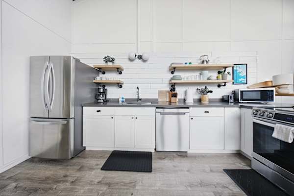 Open kitchen with stainless steel appliances 