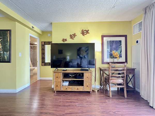 Enjoy watching your favorite shows on your 65" smart TV in the living room